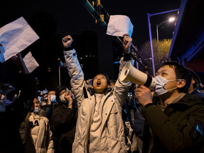 Protesters shout slogans during a protest against Chinas strict zero COVID measures on November 28, 2022 in Beijing, China. Protesters took to the streets in multiple Chinese cities after a deadly apartment fire in Xinjiang province sparked a national outcry as many blamed COVID restrictions for the deaths. (Photo by …