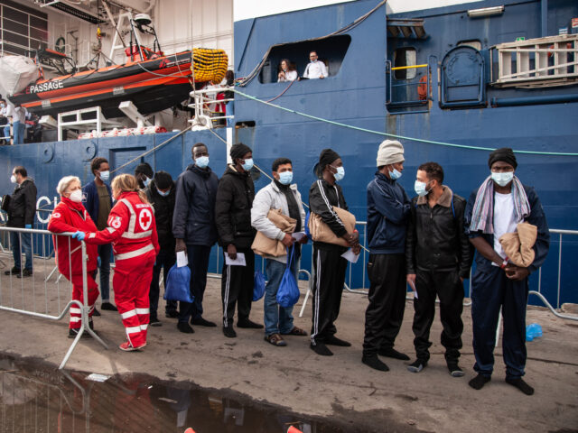 SALERNO, ITALY - DECEMBER 11: Migrants during the disembarking operations from the ship Geo Barents on December 11, 2022 in Salerno, Italy. 248 migrants rescued by the Geo Barents ship of the NGO Doctors Without Borders landed in the port of Salerno in the southern Mediterranean Sea. Among the landed …