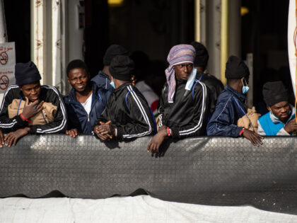 SALERNO, ITALY - DECEMBER 11: Migrants during the disembarking operations from the ship Geo Barents on December 11, 2022 in Salerno, Italy. 248 migrants rescued by the Geo Barents ship of the NGO Doctors Without Borders landed in the port of Salerno in the southern Mediterranean Sea. Among the landed …