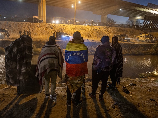 Migrants in Mexico contemplate crossing the border following the deployment of Texas National Guard soldiers. (Photo by John Moore/Getty Images)