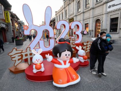 Tourists pose for photos in front of an installation depicting the number for the year "2023" at Zhonglou Street ahead of Chinese New Year, the Year of the Rabbit, on December 29, 2022 in Taiyuan, Shanxi Province of China. (Photo by Wei Liang/China News Service/VCG via Getty Images)