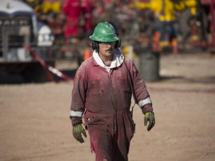 STILLWATER, OK - JANUARY 27: A Haliburton oil field worker walks past a fracking rig January 27, 2016 near Stillwater, Oklahoma. (Photo by J Pat Carter/Getty Images)
