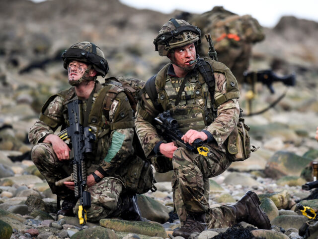 DUNDRENNAN, SCOTLAND - APRIL 26: Royal Marines come ashore as they take part in Exercise J
