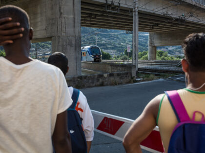 VENTIMIGLIA, ITALY - JUNE 25, 2018: Migrants look at a train that connects Italy with France, in Ventimiglia, Italy, on June 25, 2018. Each day, many of them try to hide in the train to cross the border. (Photo by Laurence Geai/For The Washington Post via Getty Images)