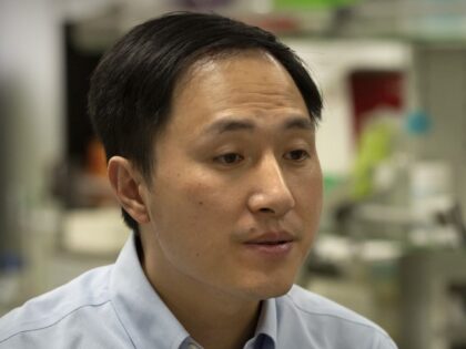 In this Oct. 10, 2018, photo, Chinese scientist He Jiankui speaks during an interview at h