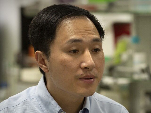 In this Oct. 10, 2018, photo, Chinese scientist He Jiankui speaks during an interview at his laboratory in Shenzhen in southern China's Guangdong province. Chinese state media says the researcher He has been sentenced to three years for practicing medicine illegally. He Jiankui was also fined 3 million yuan. Two …