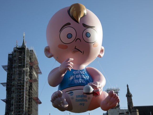 Inflatable baby promoting the idea of people having smaller families at the Global Climate Strike organised by UK Student Climate Network on 29th November 2019 in London, United Kingdom. The School strike for climate, also known as Fridays for Future, FFF, Youth for Climate and Youth Strike 4 Climate, is …