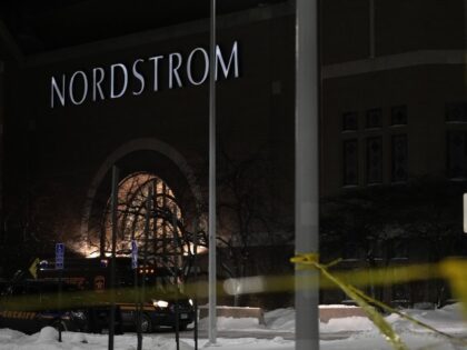 Caution tape and police cars are seen outside Nordstrom at Mall of America after a shooting, Friday, Dec. 23, 2022, in Bloomington, Minnesota. (Abbie Parr/AP)