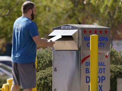 A voter drops off his ballot at a drop box, Monday, November 7, 2022, in Mesa, Ariz. (Matt York/AP)