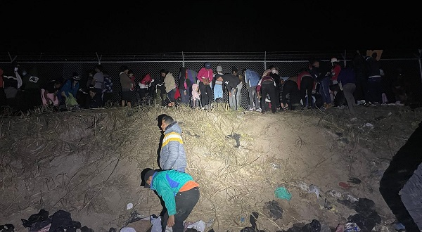 A large group of migrants discard clothing along the Texas bank of the Rio Grande after crossing from Mexico. (U.S. Border Patrol/Del Rio Sector)
