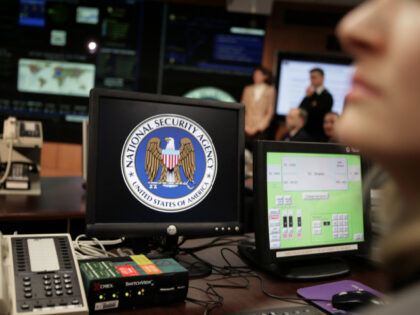 The National Security Agency (NSA) logo is shown on a computer screen inside the Threat Op
