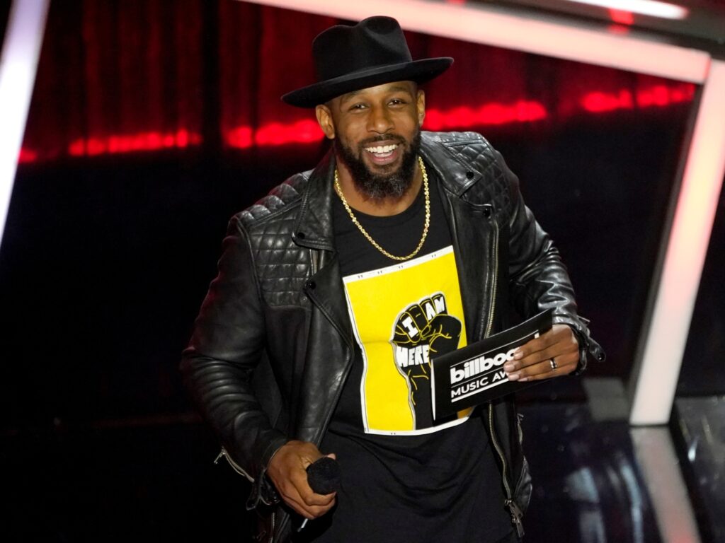 Stephen "tWitch" Boss presents the award for top Latin artist at the Billboard Music Awards on Wednesday, Oct. 14, 2020, at the Dolby Theatre in Los Angeles. (AP Photo/Chris Pizzello)