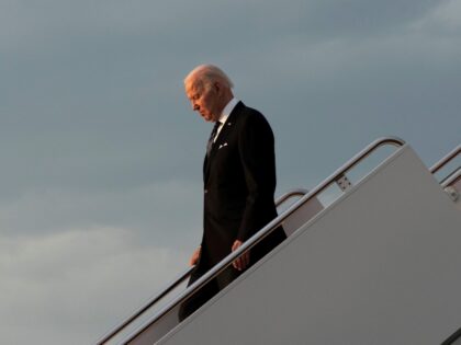 President Joe Biden exits Air Force One at sunset, Sunday, May 1, 2022, at Andrews Air Force Base, Md., on return from Minneapolis where he spoke at the memorial service of former Vice President Walter Mondale. (AP Photo/Jacquelyn Martin)