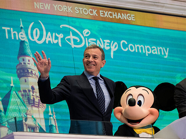 Chief executive officer and chairman of The Walt Disney Company Bob Iger and Mickey Mouse