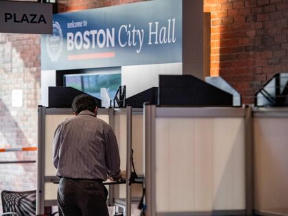 A person fills out their ballot in Boston City Hall in the US midterm election, in Boston,