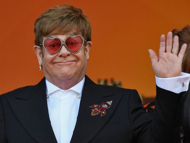 British singer-songwriter Elton John waves as he arrives for the screening of the film "Rocketman" at the 72nd edition of the Cannes Film Festival in Cannes, southern France, on May 16, 2019. (Photo by CHRISTOPHE SIMON / AFP) (Photo by CHRISTOPHE SIMON/AFP via Getty Images)