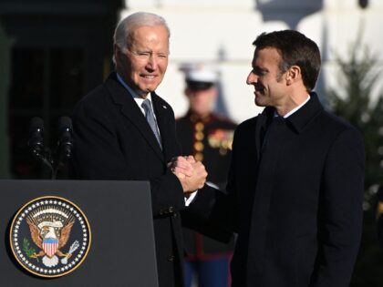 US President Joe Biden(L) shakes hands with French President Emmanuel Macron at the White House in Washington, DC, on December 1, 2022. (Photo by SAUL LOEB / AFP) (Photo by SAUL LOEB/AFP via Getty Images)