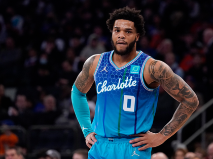Charlotte Hornets forward Miles Bridges stands on the court during the first half of an NBA basketball game against the New York Knicks on Jan. 17, 2022, in New York. Bridges pleaded not guilty Wednesday, July 20, 2022, to felony domestic violence charges filed by Los Angeles County prosecutors after …