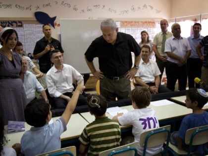 Israeli Prime Minister Benjamin Netanyahu visits a classroom on the first day of the Israeli school year in the city of Modiin on September 1, 2009. The United States said Monday it would be "quite happy" if Israel and the Palestinians were to make progress on reviving Middle East peace …