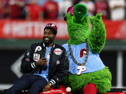 PHILADELPHIA, PENNSYLVANIA - NOVEMBER 03: Rapper Meek Mill and Phillie Phanatic on the field prior to the start of Game Five of the 2022 World Series at Citizens Bank Park on November 03, 2022 in Philadelphia, Pennsylvania. (Photo by Elsa/Getty Images)