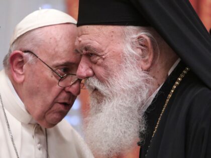 FILE - Pope Francis meets Archbishop of Athens and leader of Greece's Orthodox Church, Ieronymos II at the Orthodox archbishopric in Athens, Greece, on Dec. 4, 2021. Pope Francis has decided to send back to Greece the three fragments of Parthenon Sculptures that the Vatican Museums have held for centuries, …