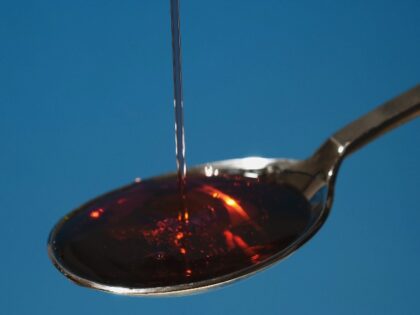 Cough syrup poured onto spoon, close-up (Photo by Universal Images Group via Getty Images)