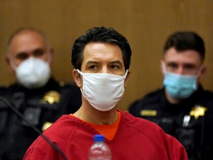 FILE - Scott Peterson listens during a a hearing to determine whether he gets a new trial for the 2002 murder of his pregnant wife, Laci Peterson, and unborn son because of juror misconduct at the San Mateo County Superior Court in Redwood City, Calif., on Feb. 25, 2022. A …