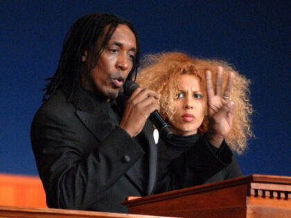 Ronald Turner, son of Ike and Tina Turner, speaks to the congregation with his wife at his