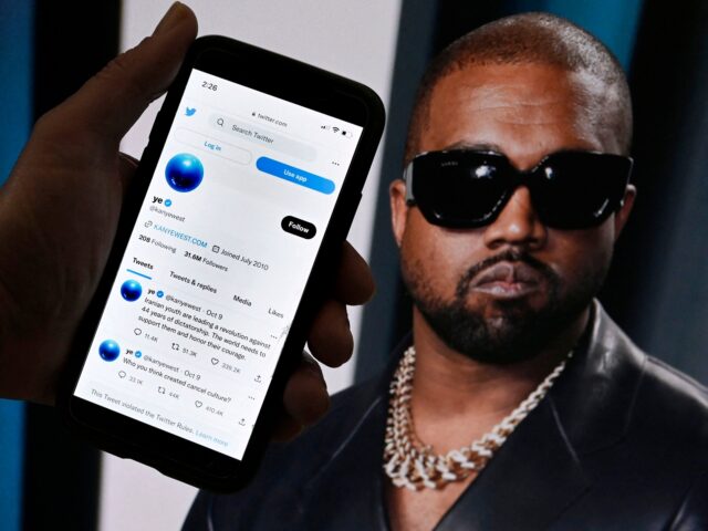 n this photo illustration, the Twitter account of Kanye West is displayed on a mobile phone with a photo of him shown in the background on October 28, 2022 in Washington, DC. - Rapper Kanye West's Twitter account, which was temporarily locked out after posting anti-Semitic remarks, appeared to be …