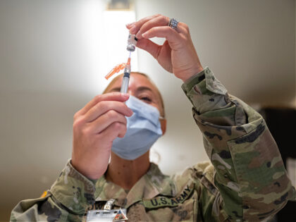 FORT KNOX, KY - SEPTEMBER 09: A Preventative Medicine Services technician fills a syringe with a Janssen COVID-19 vaccine on September 9, 2021 in Fort Knox, Kentucky. The Pentagon, with the support of military leaders and U.S. President Joe Biden, mandated COVID-19 vaccination for all military service members in early …