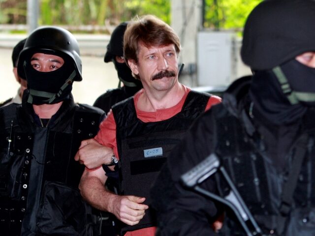 FILE - Suspected Russian arms smuggler Viktor Bout, center, is led by armed Thai police commandos as he arrives at the criminal court in Bangkok, Thailand in Oct. 5, 2010. The Associated Press and other news organizations have reported that Washington has offered to exchange Griner and Whelan for Viktor …