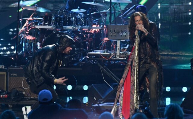 Aerosmith's Steven Tyler, seen here with Eminem, is being sued by a woman who claims he se