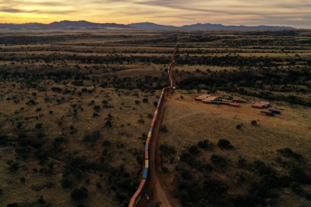 From the air, the makeshift wall of shipping containers along the US-Mexico border in Ariz