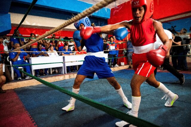 Elianni Garcia Polledo (in red) was the victor Saturday in the first official women's boxi