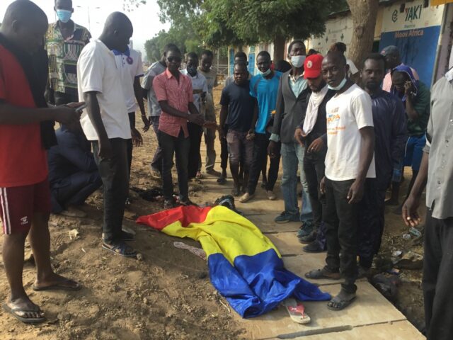 Fatal protest: A body covered by a Chadian flag after the October 20 unrest