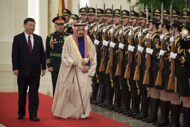 In this file photo, Saudi King Salman reviews an honour guard with Chinese President Xi Ji