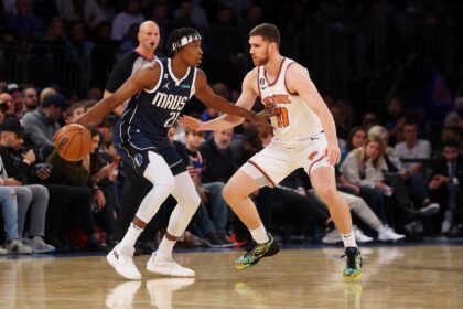 Frank Ntilikina of Dallas drives to the basket against New York's Svi Mykhailiuk in the Mavericks' 121-100 NBA victory over the Knicks