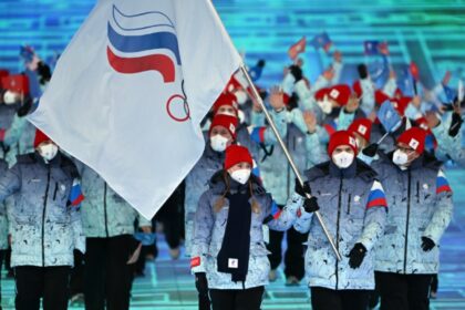 Russia athletes carrying the country's Olympic flag march at the Beijing Olympic Games