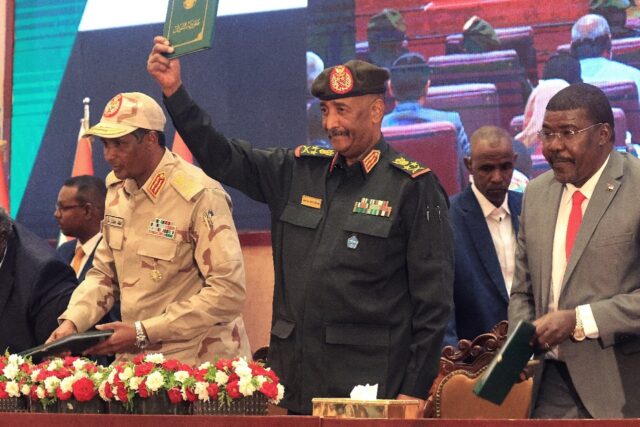 Sudan's Army chief Abdel Fattah al-Burhan (center) and paramilitary commander Mohamed Hamd