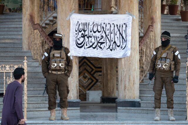 Taliban security personnel stand guard at the Afghan international exhibition centre in Ka