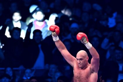 Triumphant champion - Britain's Tyson Fury celebrates retaining his WBC heavyweight title after a 10th-round stoppage of Derek Chisora
