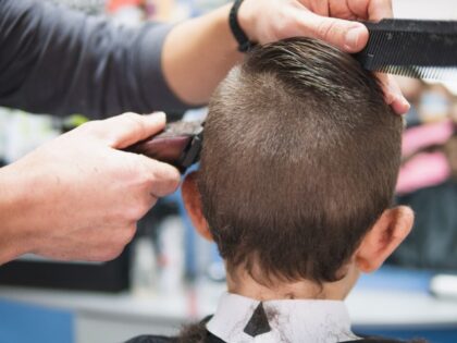 young boy having a haircut