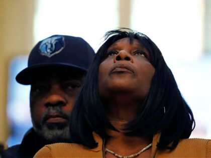 RowVaughn Wells, mother of Tyre Nichols, who died after being beaten by Memphis police officers, is comforted by Tyre's stepfather Rodney Wells, at a news conference with civil rights Attorney Ben Crump in Memphis, Tenn., Friday, Jan. 27, 2023. (AP Photo/Gerald Herbert)