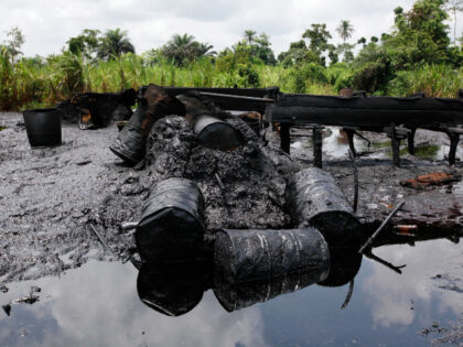 In this photo taken Saturday, May 18, 2013, an abandoned illegal refinery is seen at the creeks of Bayelsa, Nigeria. The first drops of crude float in the languid muddy currents of Nigeria's oil-rich southern delta, then slowly grow into the splatter of massive crime scene. Oil thefts, long a …