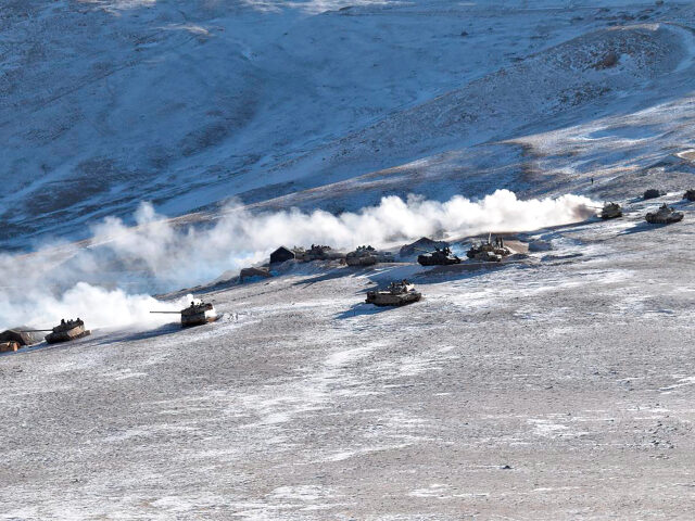 FILE - In this Feb. 10, 2021, file photo provided by the Indian Army, tanks pull back from the banks of Pangong Tso lake region, in Ladakh along the India-China border. The foreign ministers of India and China have met in Tajikistan, Wednesday, July 14, 2021 with New Delhi stressing …