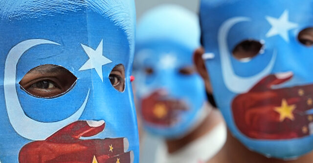 Uyghurs Protest Corporate China Support: Tesla and Chase 'Complicit' in Genocide