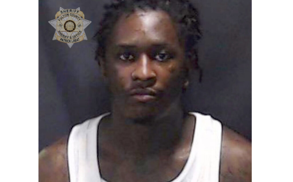 This booking photo provided by Fulton County Sheriff’s Office shows a booking photo of Atlanta rapper Young Thug. The Atlanta rapper, whose name is Jeffery Lamar Williams, was one of 28 people indicted Monday, May 9, 2022, in Georgia on conspiracy to violate the state's RICO act and street gang charges, according to jail records. (Fulton County Sheriff’s Office via AP)