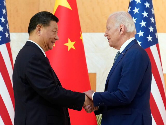 FILE - U.S. President Joe Biden, right, and Chinese President Xi Jinping shake hands before their meeting on the sidelines of the G20 summit meeting, Nov. 14, 2022, in Nusa Dua, in Bali, Indonesia. (AP Photo/Alex Brandon, File)