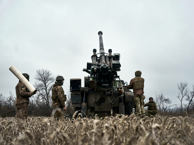Ukrainian soldiers prepare to fire a French-made CAESAR self-propelled howitzer towards Ru