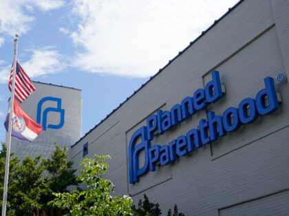 FILE - Missouri and American flags fly outside Planned Parenthood in St. Louis, June 24, 2022. On Wednesday, Dec. 28, a judge rejected Missouri lawmakers' efforts to stop Planned Parenthood from receiving any public funding. (AP Photo/Jeff Roberson, File)